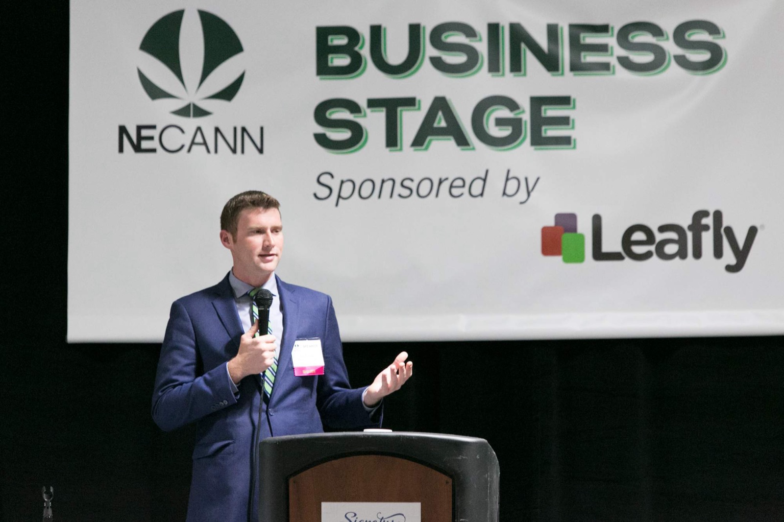 A speaker on the NECANN Business Stage