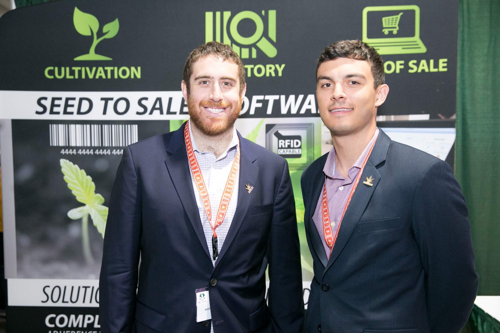 Exhibitors at a NECANN booth