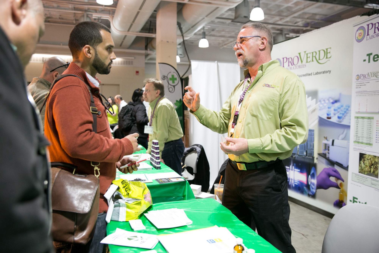 Exhibitors and attendees talking shop on the floor